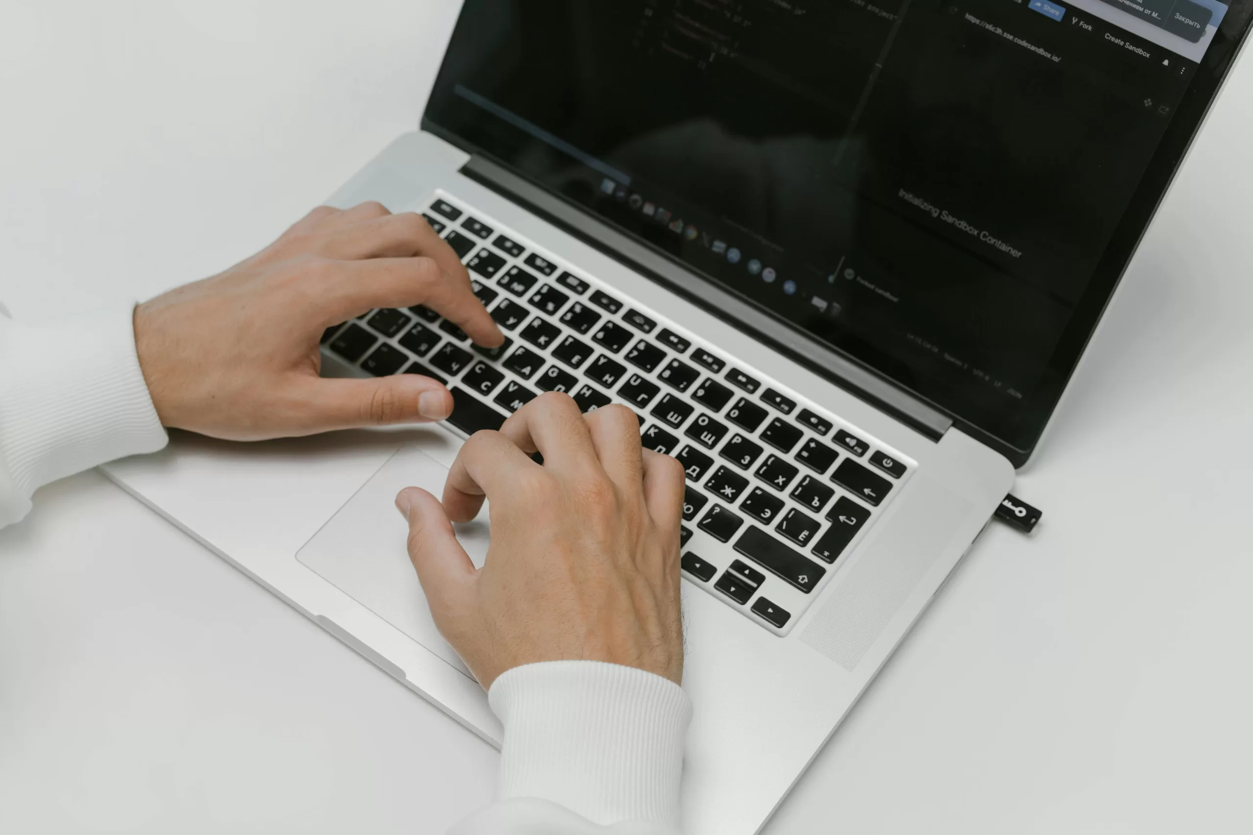 Closeup of hands on a laptop keyboard - Copilot in Teams blog image